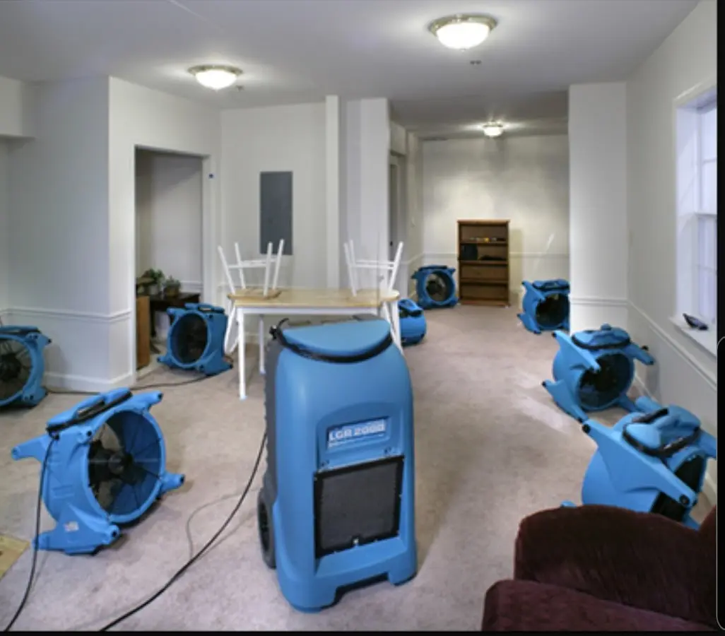 Air movers and dehumidifier setup for Water Damage Restoration in New Castle